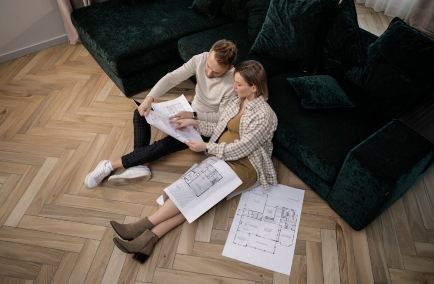 a couple looking at a renovation plan