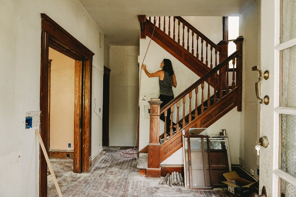 a woman assessing a home's current condition